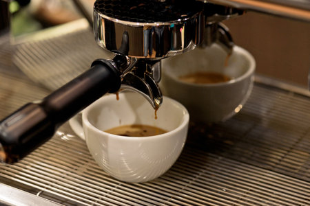 Coffee machine making espresso in a white cup, close upの写真素材