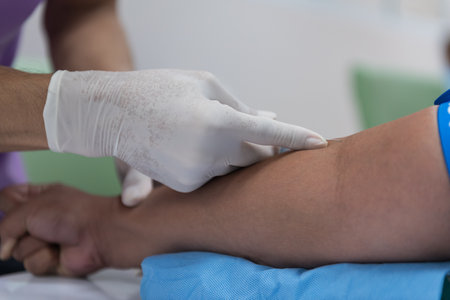 Close-up of hands of physiotherapist doing leg massage to patientの写真素材