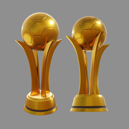 Golden soccer balls on silver and bronze pedestal isolated on grey backgroundの写真素材