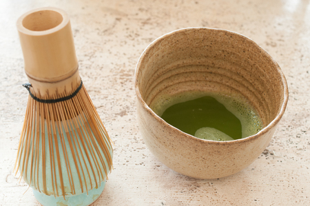 powdered green tea in cupの写真素材