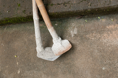 tool digging a hole in the ground with shovel and spadeの写真素材