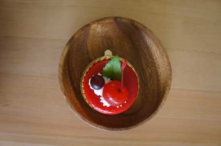 Mousse strawberry on a wooden backgroundの写真素材