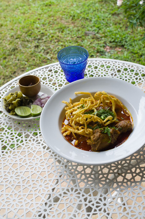 Curried Noodle Soup (Khao soi) with spicy coconut milk. Noodle Soup with beef. Curried noodle soup. Noodle Thai cuisine northern style. Khao Soi Recipe. Thai food.の写真素材