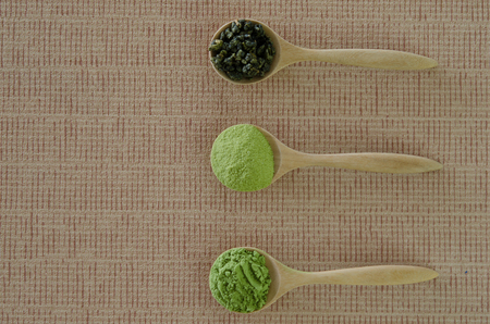Wooden spoon with powdered matcha green teaの写真素材