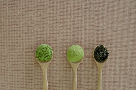 Wooden spoon with powdered matcha green teaの写真素材