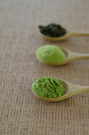 Wooden spoon with powdered matcha green teaの写真素材