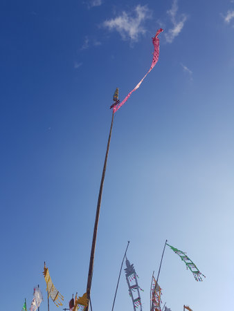 Flags planted on the ground flutter in the wind to make religious ceremonies bring auspiciousness.の写真素材