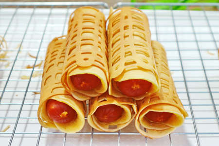 'Khanom Tokyo' (Rolled Pancake Stuffed With Sausage)の写真素材