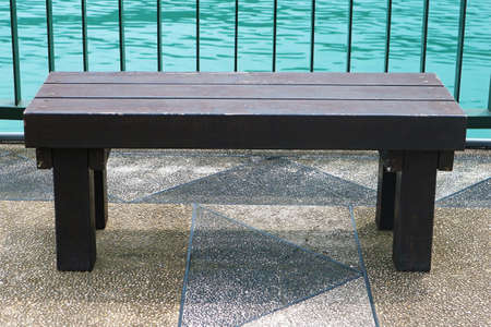 Old Outdoor Wooden Bench Isolated on the Pier