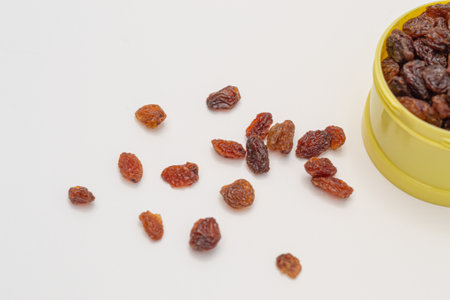 Raisins scattered on a white background. Healthy snackの写真素材