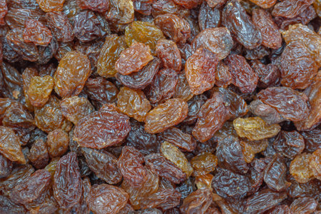 Background of a bunch of raisins. Macro image.の写真素材