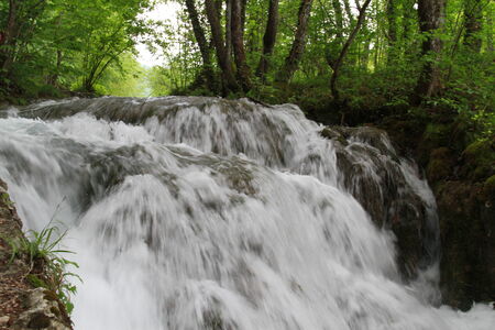 Water flowing downwards in Plitvice lake, Croatiaの写真素材