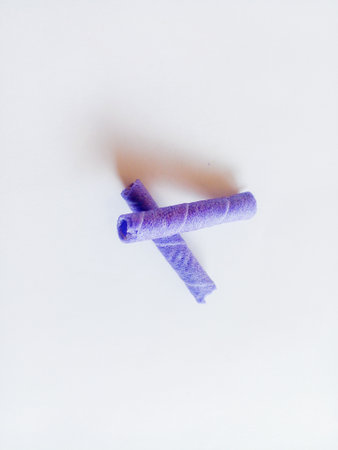 Purple wafer roll isolated on white background.の写真素材