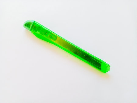 Green cutter knife isolated on white background. Tool for cutting paper.の写真素材