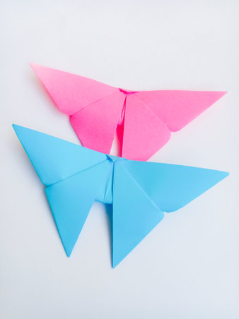 Pink and blue bird origami. Origami birds isolated on white background.の写真素材