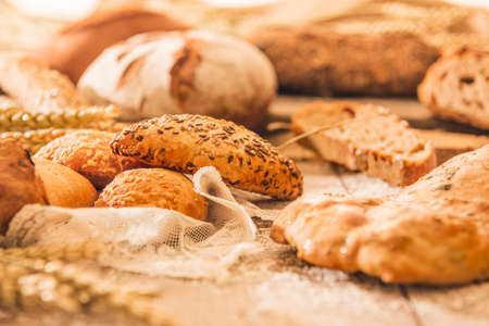 Bun of beautiful breads on rustic table.の写真素材