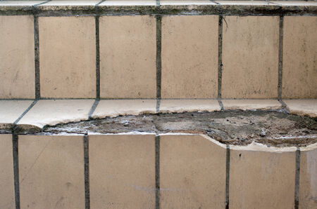 An old staircase with broken tilesの写真素材