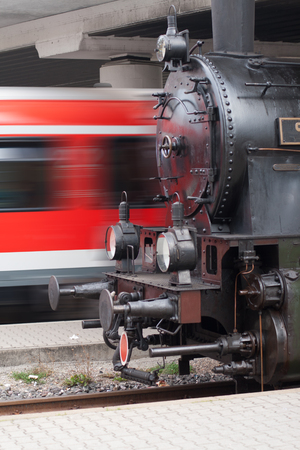 Steam locomotive and passenger train, symbolic for fast or slowの写真素材