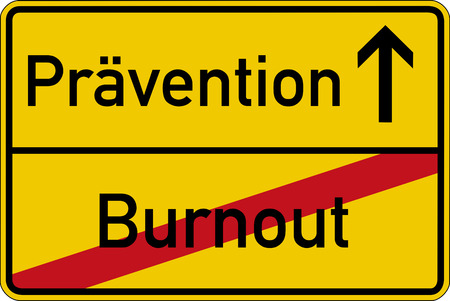 The German words for burnout and prevention (Burnout and Pr?vention) on a road signの写真素材