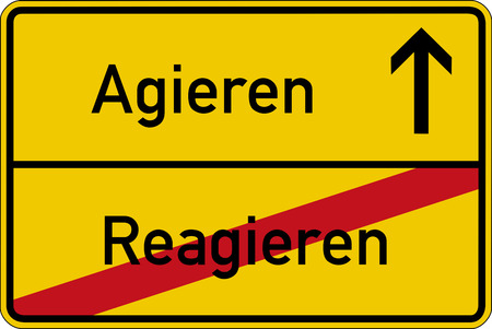 The German words for react and act (reagieren and agieren) on a road signの写真素材