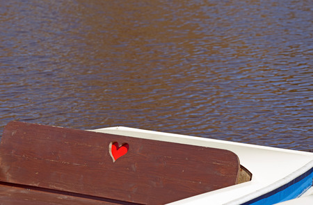 Pedalo boat with heart on a lakeの写真素材