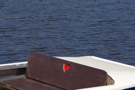 Pedalo boat with heart on a lakeの写真素材