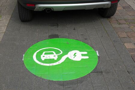 Sign for charging station for electric cars on asphaltの写真素材