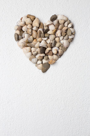 Heart of shells on textured plaster, copy spaceの写真素材