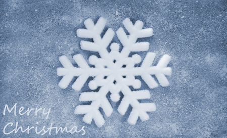 Snowflake, grey fiber fabric, blue glitter film and the words Merry Christmasの写真素材