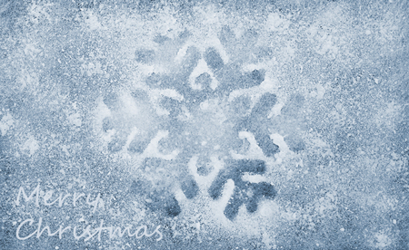 Snowflake, grey fiber fabric, blue glitter film and the words Merry Christmasの写真素材