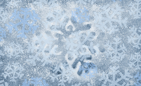 Several dark and light blue snowflakes, cold winter backgroundの写真素材