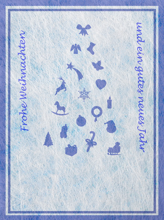 Abstract christmas tree with various christmas motifs and the german word for Merry Christmas and a happy New Yearの写真素材