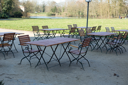 Tables and chairs in a public parkの写真素材