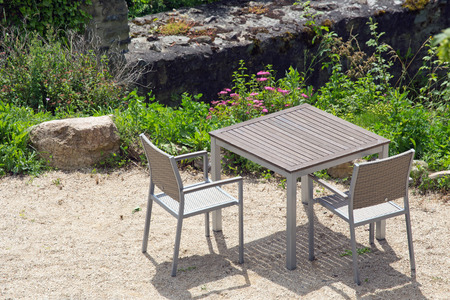 Tables and chairs in a public parkの写真素材