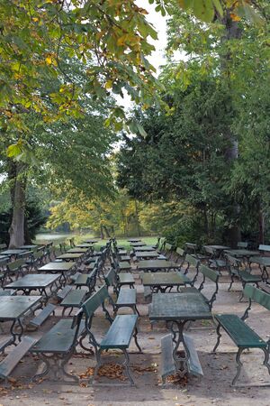 Tables and chairs in a public parkの写真素材