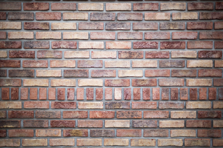 Brick wall with different coloured bricks, close upの写真素材