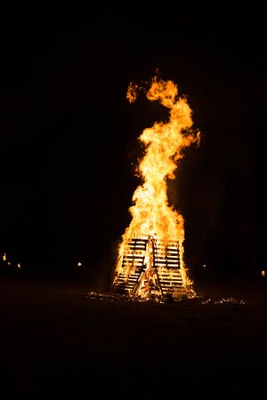 Embers fire fireplace grill fire flame, black backgroundの写真素材