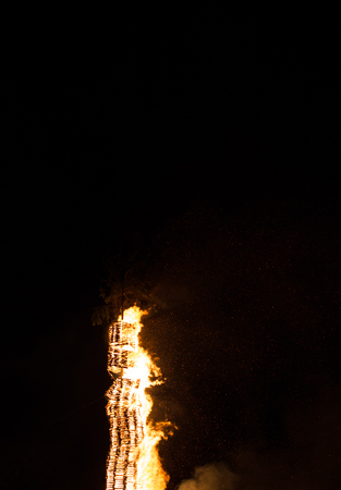 Embers fire fireplace grill fire flame, black backgroundの写真素材