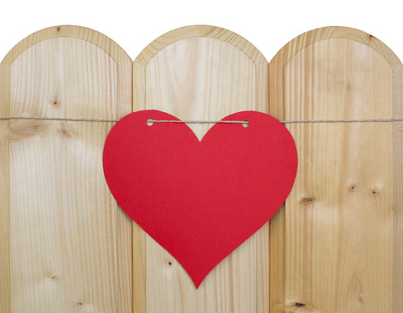 Heart of paper on a cord on woodの写真素材
