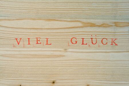 Stamped german text for Good luck on wood, backgroundの写真素材