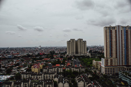 Cityscape view with cloudy sky