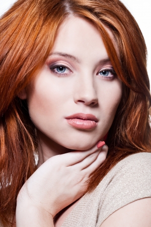 Closeup portrait of a sexy young woman with red hair and natural makeupの写真素材