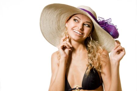 Beautiful sexy young girl in swimsuit and in hatの写真素材
