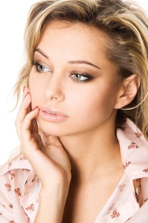 Closeup studio portrait of beautiful sexy young blond woman, isolated on white backgroundの写真素材