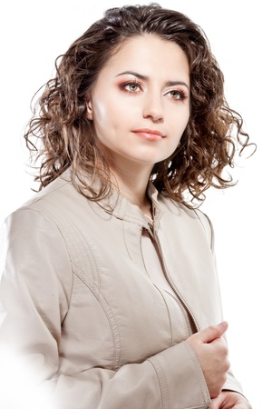 Face of a young brunette woman with curly hairの写真素材