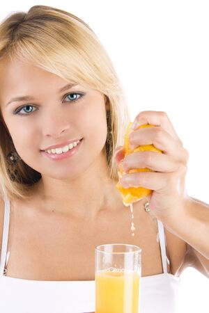 Young woman making fresh juiceの写真素材