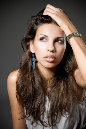Closeup studio portrait of a beautiful young arabic womanの写真素材