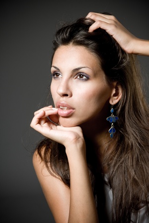 Closeup studio portrait of a beautiful young arabic womanの写真素材