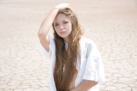 Beautiful girl in a desertの写真素材