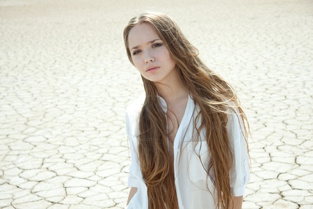 Beautiful girl in a desertの写真素材